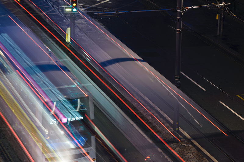 Long exposure showing the light streaks of buses on Prices St from an elevated position