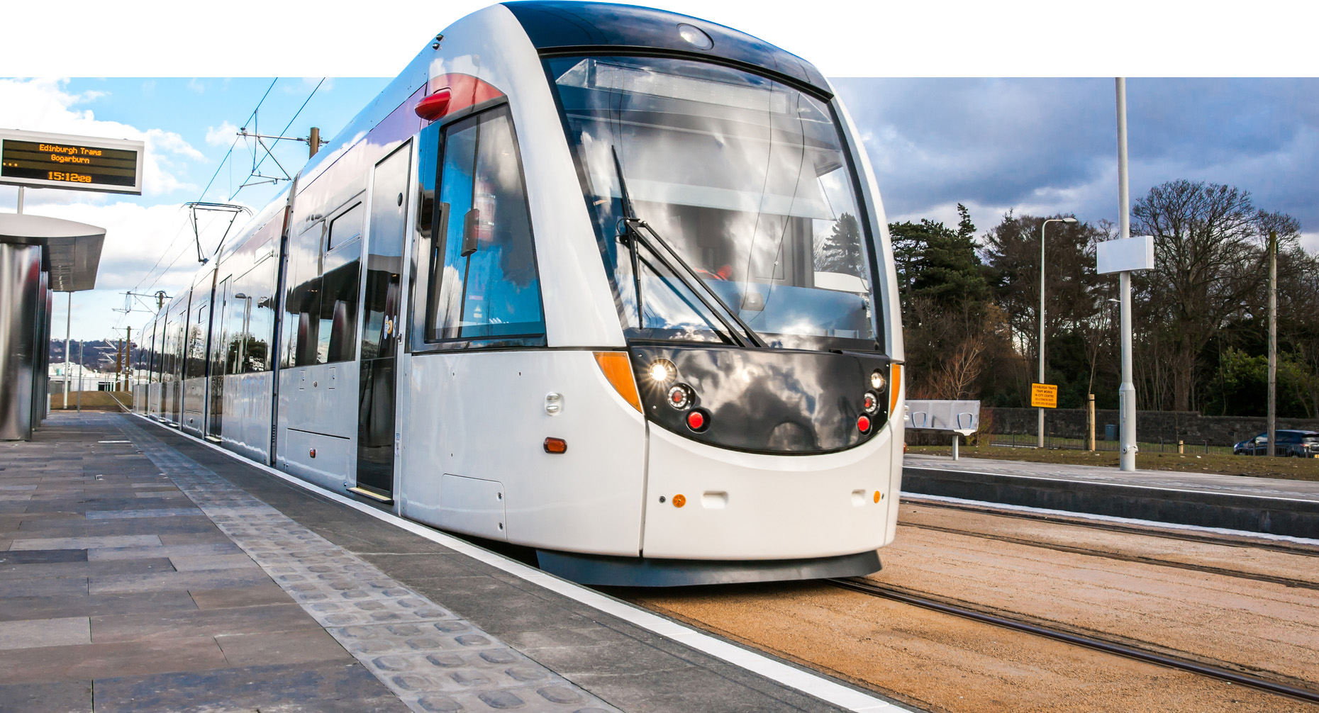 An Edinburgh tram photographed at a stop from a low angle