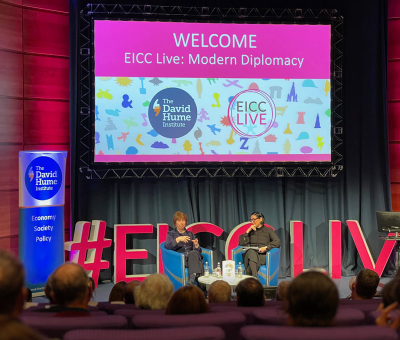 Image of speakers on stage at EICC Live: Modern Diplomacy