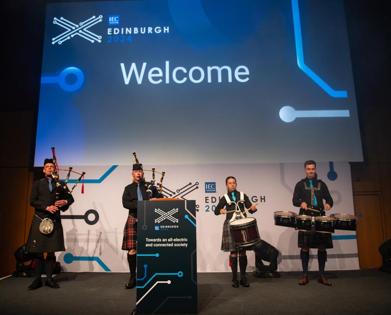 A pipe band play to welcome delegates
